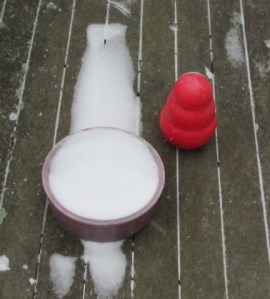 Kong stands guard over snowy disk.