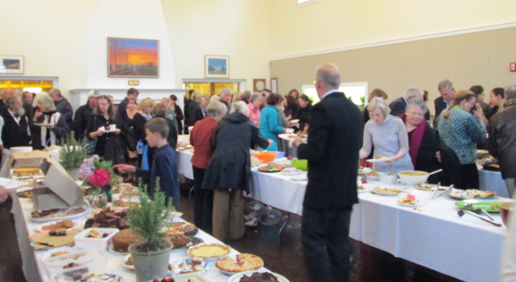 Community potluck in the Ag Hall foyer