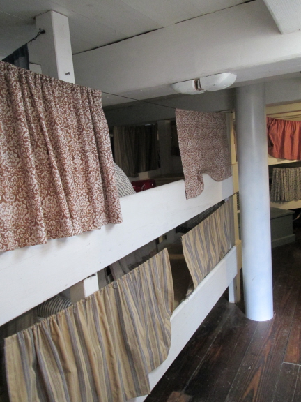 The fo'c's'le (forecastle), where the crew slept. The Morgan is "beamy," relatively wide, which means there was room for each crew member to have his own bunk. The bunks were relatively long -- up to six feet -- but the headroom wasn't much.