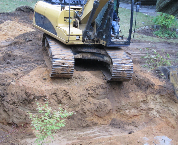 Excavator at the brink